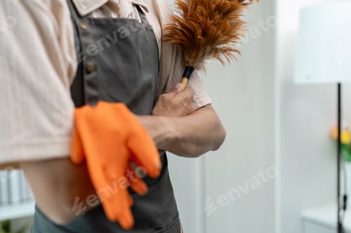 Preview: Professional Housekeeper with Cleaning Tools in Modern Home Setting for Efficient Housekeeping