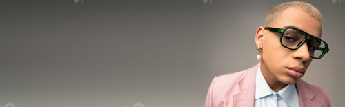 Preview: Stylish man exuding confidence and charm with a touch of elegance in a modern setting