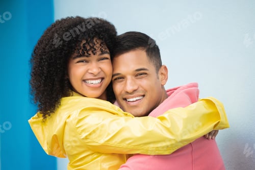 Preview: Couple, smile and hug in portrait with face, love and commitment, happiness isolated on blue backgr