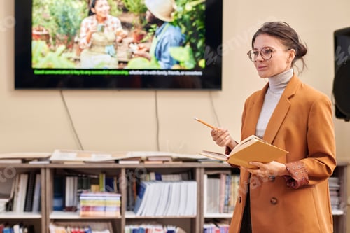 Preview: Smiling Female Professor Giving Lecture in College