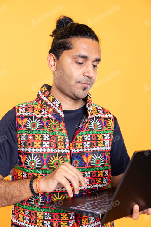 Preview: Man typing on laptop, frustrated with malfunctioning keyboard