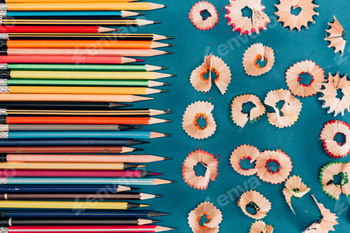 Preview: Top view of composition of colorful pencils and cuttings isolated on blue background
