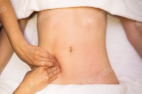 Preview: Woman receiving a belly massage in a physiotherapy center