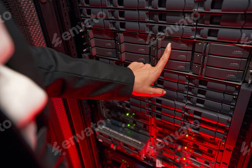 Preview: Woman system administrator maintain servers in data center