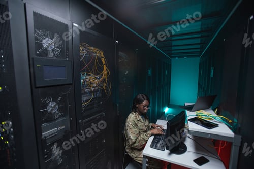Preview: Ethnic Young Woman Managing Server Network
