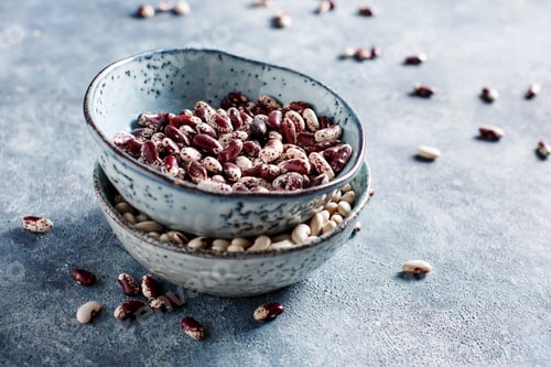 Preview: Red and white beans in bowls,top view.