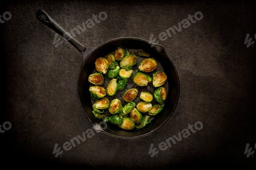 Preview: Top view of a pan of brussels sprouts in dim lighting