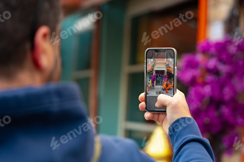 Preview: Man tourist is taking photo on his phone in Istanbul