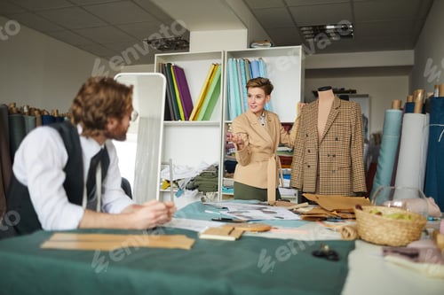 Preview: Designers Discussing a Jacket Design in a Studio