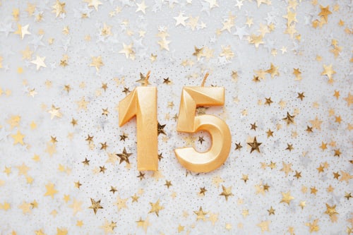 Preview: Number 15 fifteen golden celebration birthday candle on Festive Background