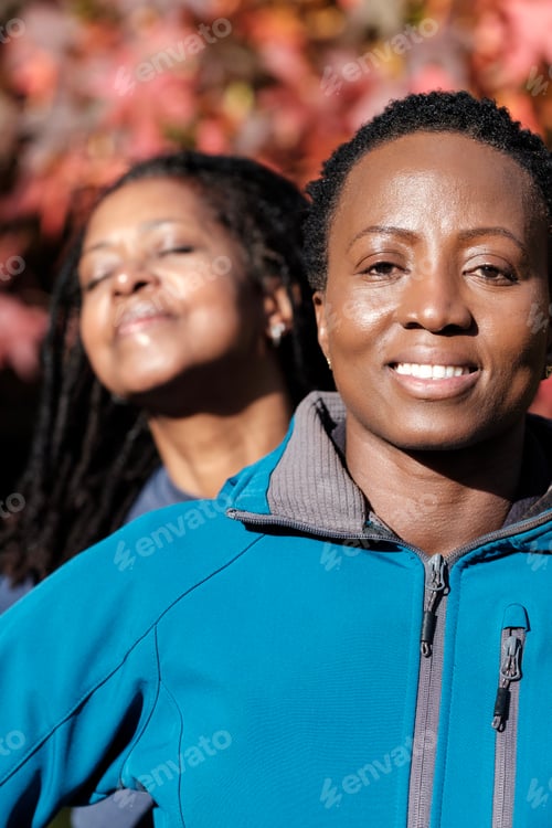 Preview: Authentic portrait of two fitness women outdoors.