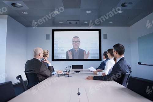 Preview: Businessmen and women watching office conference call