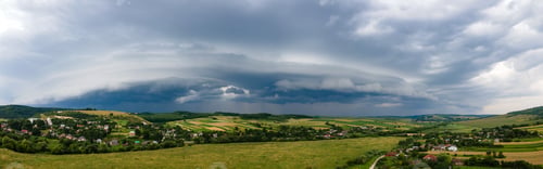 Preview: Landscape of dark clouds forming on stormy sky during thunderstorm over rural area.