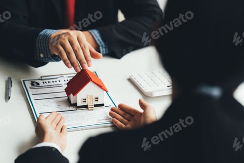 Preview: Buying a Home or Insurance, an insurance agent explains the lease agreement to a client before makin