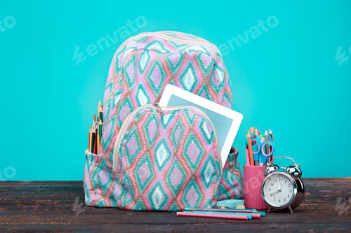 Preview: Back to School concept. Books, colored pencils and backpack