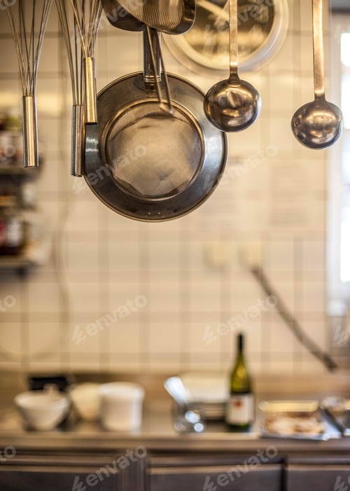 Preview: Metal utensils hanging in commercial kitchen