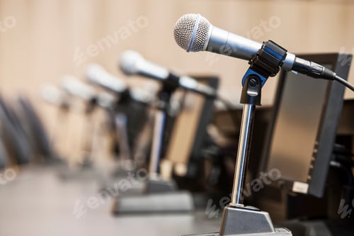 Preview: Microphones at a political meeing in city hall.