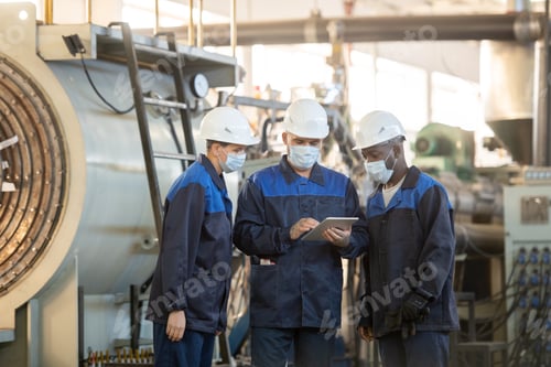 Preview: Group of young contemporary workers of industrial plant looking through online sketches of details