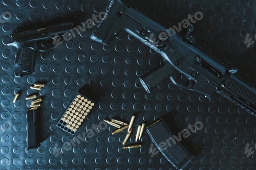 Preview: top view of gun and rifle with bullets on table