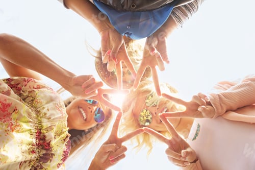 Preview: Group of happy friends showing signs