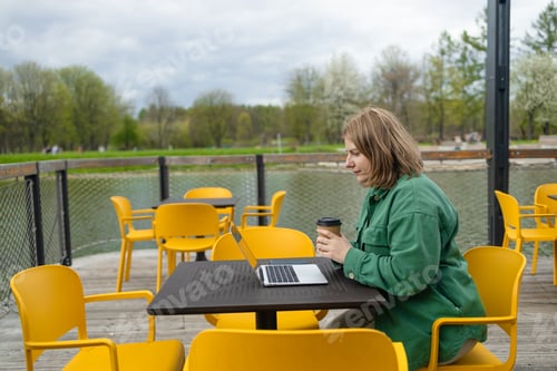 Preview: Happy successful European businessman makes a phone call on smartphone, talking and smiling outdoors