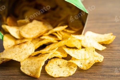 Preview: Potato chips, delicious spicy for crips, thin slice deep fried snack fast food in open bag.