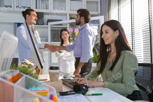 Preview: Group of multiethnic young business friends gathered in a modern office conference room