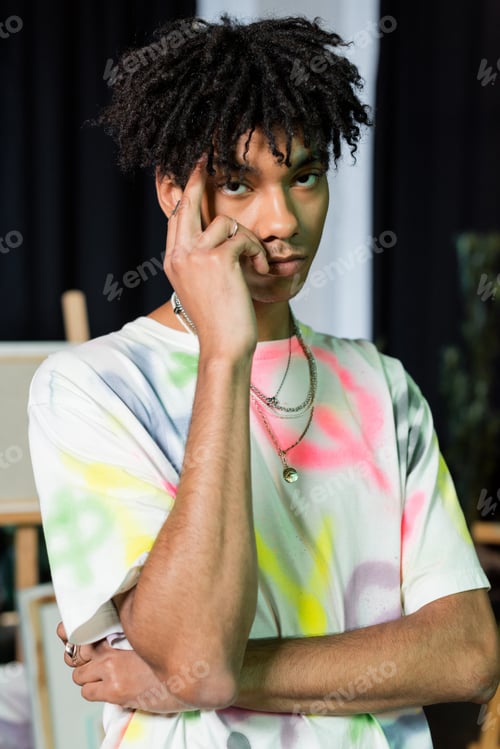 Preview: Young african american artist looking at camera in workshop