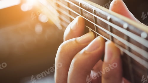 Preview: Hands of man playing electric guitar close up