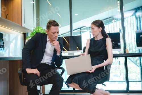 Preview: Smart looking colleague or coworker is consulting, discussing or brainstorming of company strategy