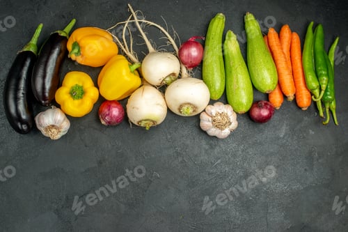 Preview: top view fresh vegetables eggplants bell-peppers and other vegetables on dark background food color