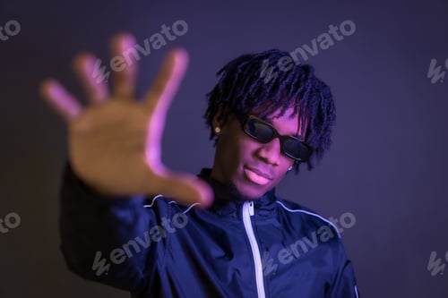 Preview: Free style african young artist posing in studio