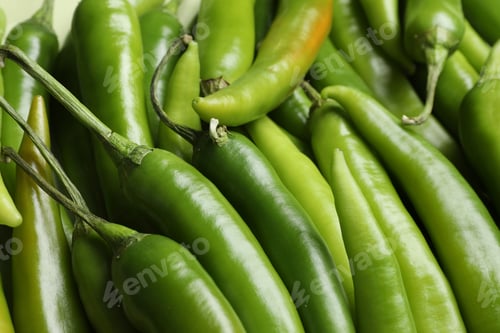 Preview: Ripe green chili peppers as background, closeup