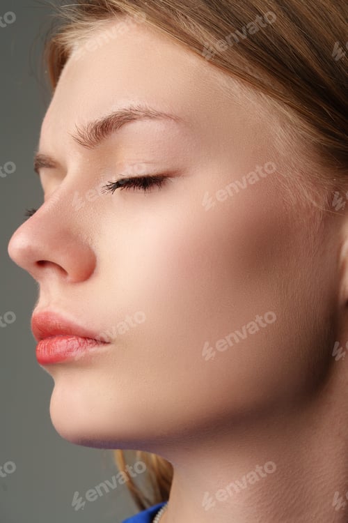 Preview: Portrait of Young Woman in Blue Top on gray background