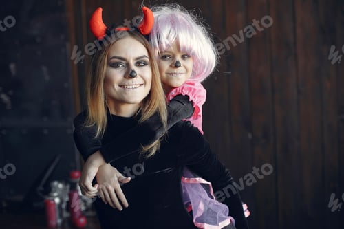 Preview: Mother with daughter in a halloween costume and makeup
