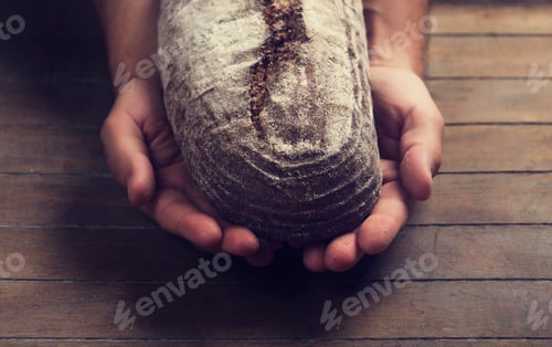Preview: Baker's hands with a bread