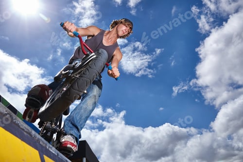 Preview: Practicing for the x games. Full length shot of a teenage boy riding a BMX at a skatepark.