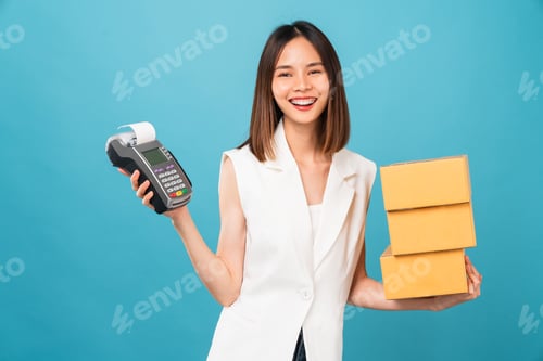 Preview: woman holding cardboard boxes and hands show Card reader machine on blue background.
