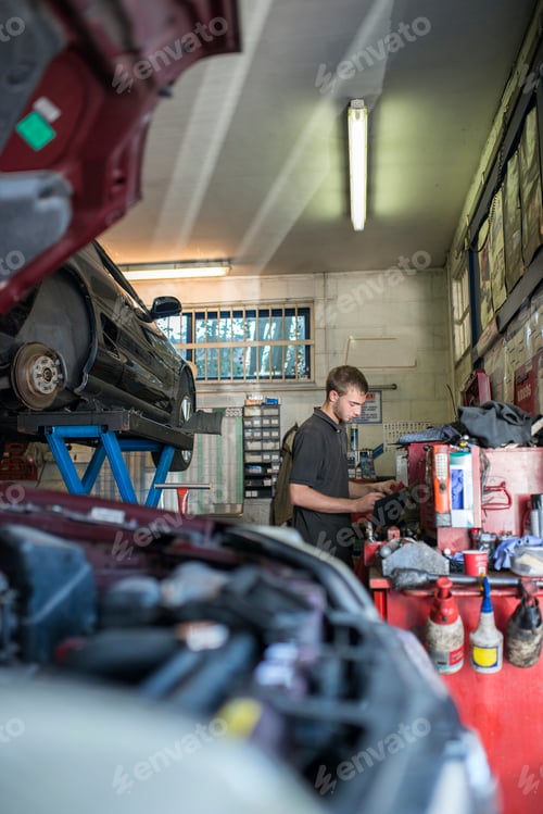 Preview: Mechanic working in garage