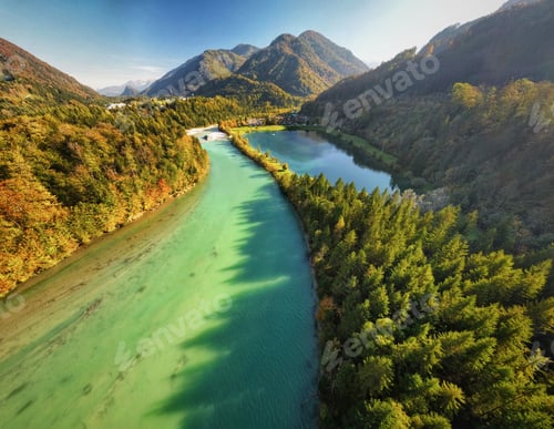 Preview: Aerial view of Steyr river flowing dense lush forests in Austria