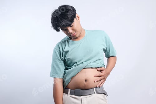 Preview: Funny Young Man Holds Fat Belly