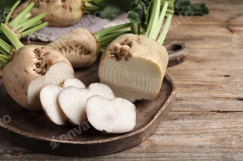 Preview: Cut sugar beets on wooden table, closeup