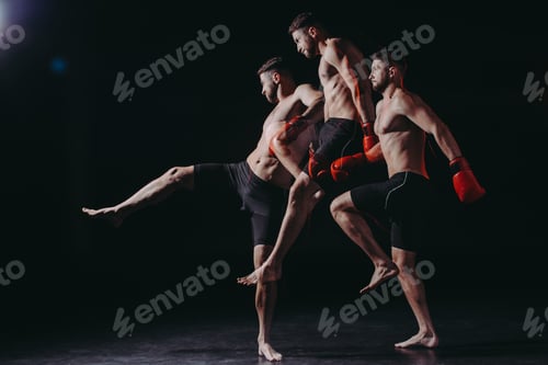 Preview: multiple exposure of strong shirtless muscular boxer in boxing gloves jumping and doing kick