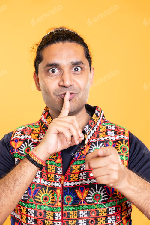 Preview: Authoritative man doing shushing hand gesturing, demanding secrecy