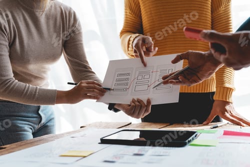 Preview: Ux ui designers come up with new ideas at a meeting to present in office mobile internet software