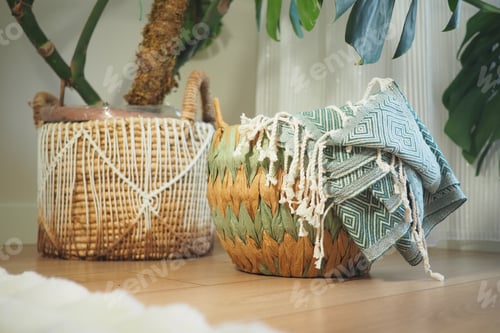Preview: Decorative woven baskets with blankets displayed indoors