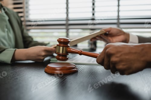 Preview: lawyers looking through client document together