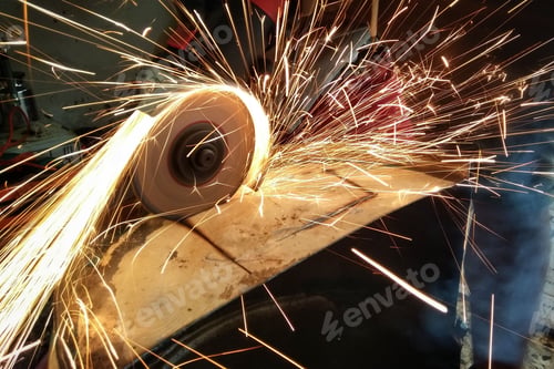 Preview: Individual operating a metal cutting machine in a manufacturing plant