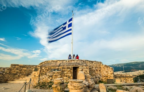 Preview: People on Ancient Ruins with Flag on Sunny Day