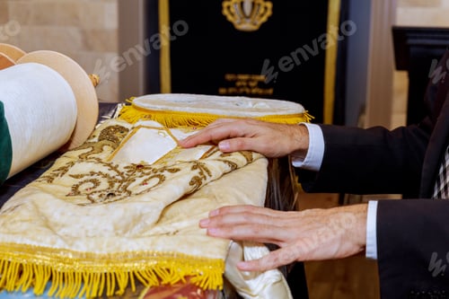 Preview: Ritual preparation of Torah scroll during religious service at synagogue